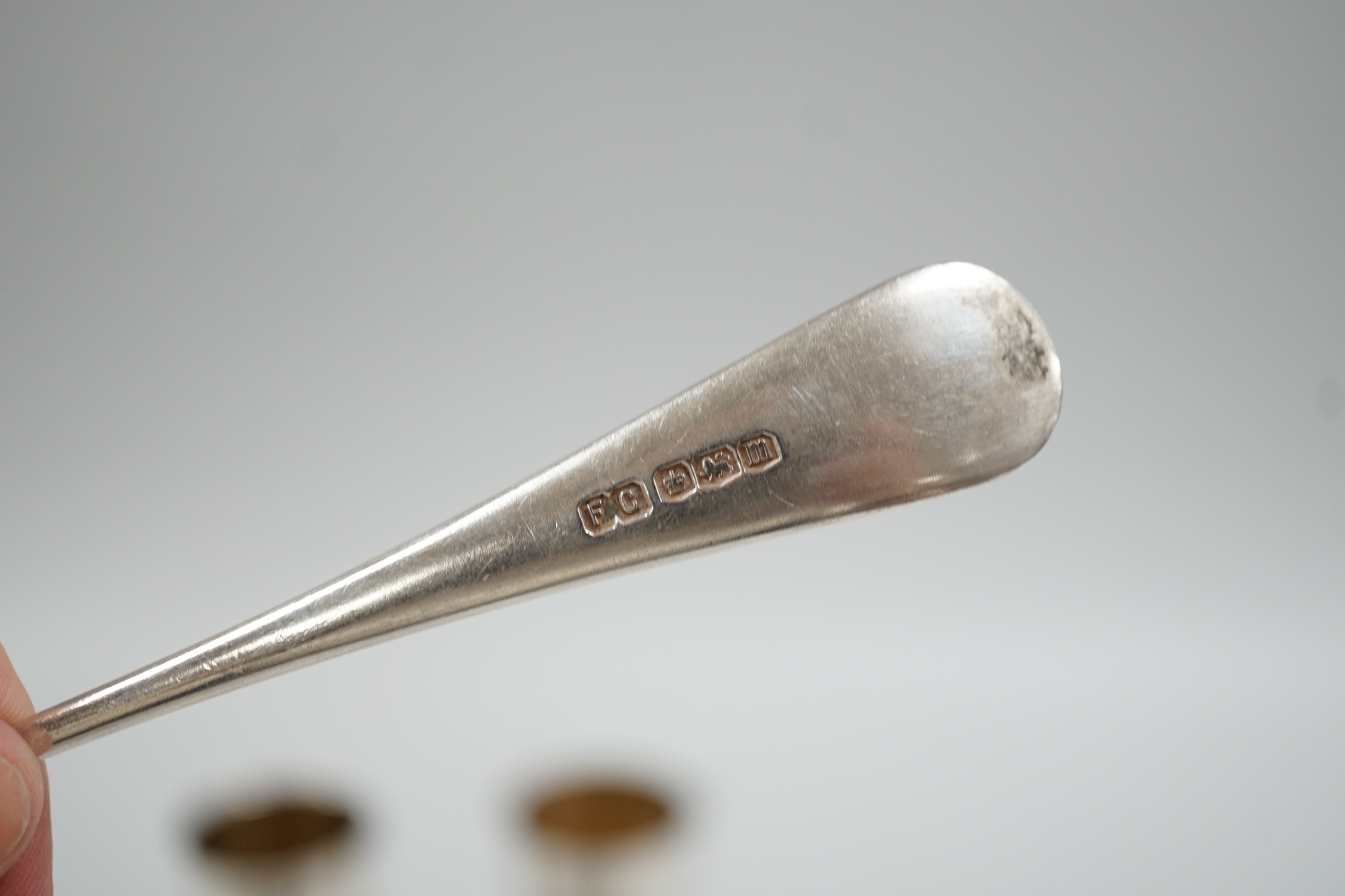 A pair of continental 800 standard white metal beakers, 75mm and four silver rat tail pattern dessert forks, Sheffield, 1929, gross weight 10.3oz.